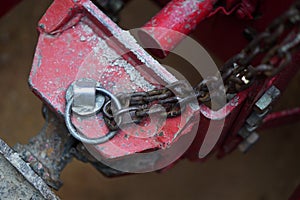 Close-up of connecting mechanism of trailer to agricultural tractor