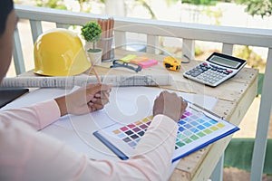 close up construction engineer man hands working at office desk architect workplace. Engineer Men hands drawing holding folder,