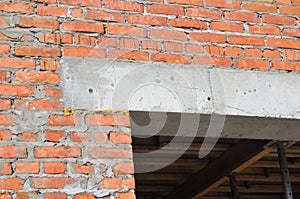 Close up on construction house door concrete lintel on brick house construction.