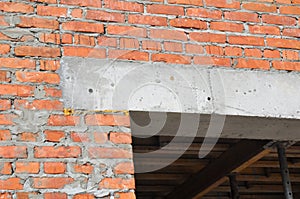 Close up on construction house door concrete lintel on brick house construction. photo