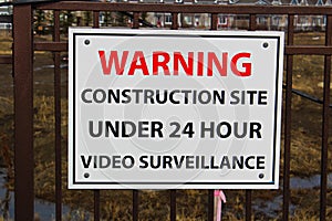 Close up of a construction site surveillance sign