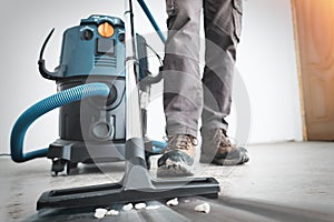 Close up on construction vacuum cleaner, construction cleaning service