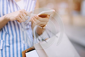 Close up of consumerism young woman holding hand many shopping bag