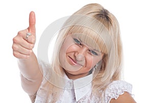 Close up of a contented young woman showing thumb isolated over white background
