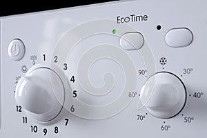 Close-up of the control panel of a washing machine. Selective focus on the eco selector