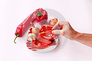 Close-up. Cook hands cutting up a salad