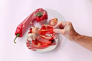 Close-up. Cook hands cutting up a salad