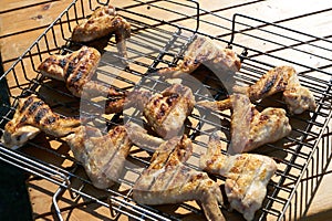 Close up of Cooking delicious Shish kebab on the grill of chicken wings