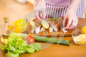 Close up cooking fish in domestic kitchen