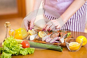 Close up cooking fish in domestic kitchen