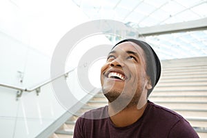 Close up of cool african american man laughing and looking up