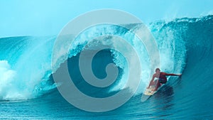 CLOSE UP: Cool surfer drags his hand through the refreshing ocean while surfing.