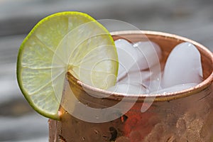 Close up of copper mug with lime