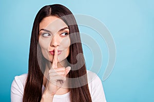 Close up copyspace photo of cunning nice cute girl pondering over some joke while isolated with blue background