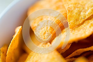 Close up of corn crisps or nachos in bowl
