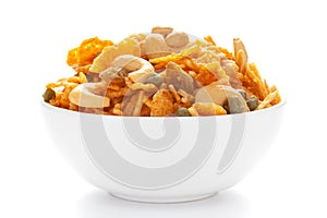 Close up of corn flex mixture Indian namkeen snacks on a ceramic white bowl.