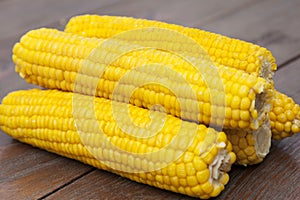 Close-up corn on wooden table photo