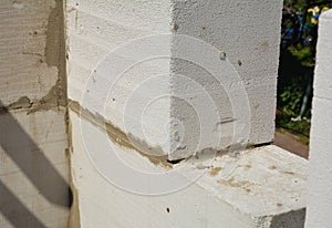 A close-up of a corner of a masonry wall made from autoclaved aerated concrete blocks AAC