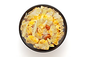 Close-up of Cornflakes Mixture Indian namkeen (snacks) on a ceramic black bowl.