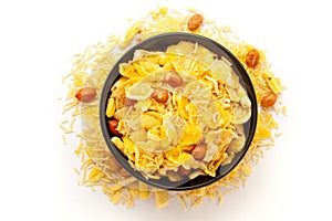 Close-up of Cornflakes Mixture Indian namkeen (snacks) on a ceramic black bowl.