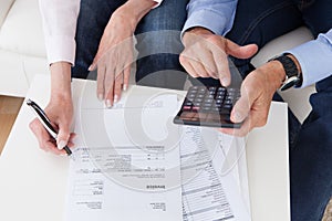 Close-up of couple doing finances at home