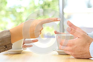 Close up of couple hands arguing at home