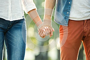 Close up of couple holding hands