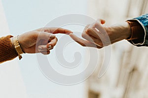 Close up of couple in love holding hands.