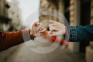 Close up of couple in love holding hands.