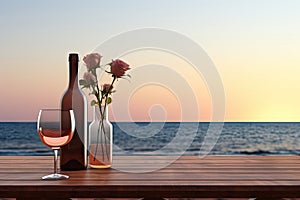 Close up of couple wine champagne glasses and bottle for celebration on wooden table with sea view and sunset sky background,