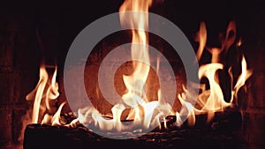 close up cozy view stone fireplace fire crackling wood with sparks