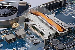A close up of CPU computer motherboard PCB with chips on it
