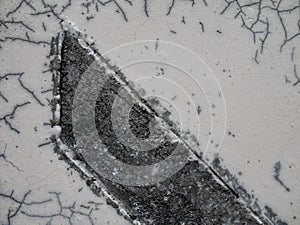 Close up of cracked ceramic, texture of black-and-white raku clay pottery, wallpaper background.