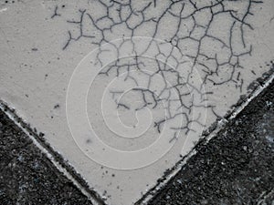 Close up of cracked ceramic, texture of black-and-white raku clay pottery, wallpaper background.