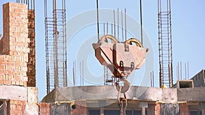 Close up of crane hook over the construction site.