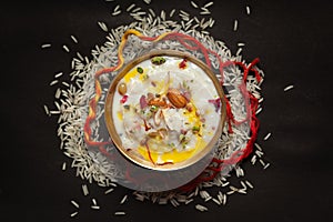 Close-up of Creamy rice Kheerkhir Garnished with saffron and dry fruits for pooja spiritually celebration. Indian delicious photo