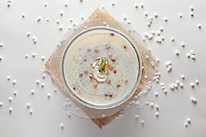 Close-up of Creamy Sabudana Kheer Garnished with dry fruits. Indian delicious dessert. Served in -white ceramic bowl.