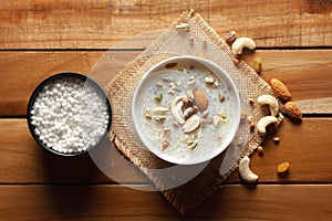 Close-up of Creamy Sabudana Kheer Garnished with dry fruits. Indian delicious dessert. Served in white ceramic bowl