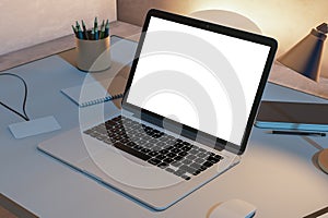 Close up of creative designer desktop with blank white laptop computer screen and supplies. Mock up, 3D Rendering. Workplace