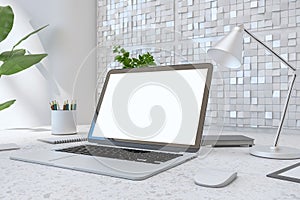 Close up of creative designer desktop with empty white laptop screen, lamp, supplies various other objects and shiny light tile