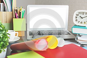 Modern workspace with empty white laptop