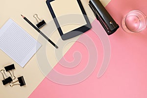 Close up of creative office desktop with empty tablet supplies and other items with copy space. Mock up