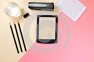 Close up of creative office desktop with empty tablet supplies and other items with copy space. Mock up.