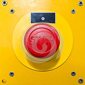 Industrial Emergency Stop Push Button on a Control Panel