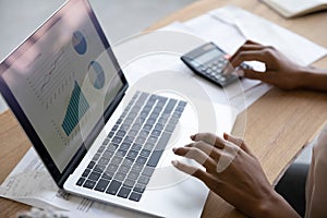 Close up cropped of African American woman working with statistics