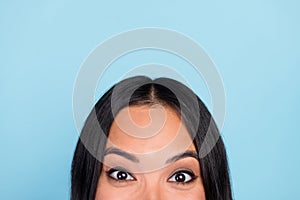 Close up cropped photo of adorable lovely impressed woman with straight hairdo staring eyes wide open  on blue