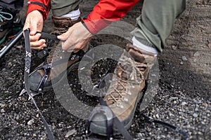 Close up cropped photo of alpinist man pull sling on anti-slip h