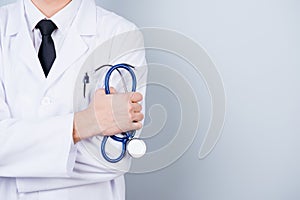 Close-up cropped photo of stethoscope in doctor`s hand. Doctor i