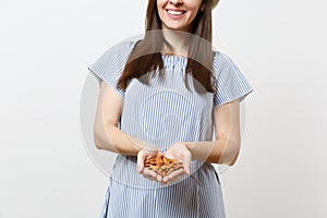 Close up cropped photo of woman hold in hands brown unprocessed almonds nuts isolated on white background. Proper