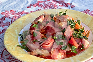 Close-up cropped shoot of oil tomato and carrot salad